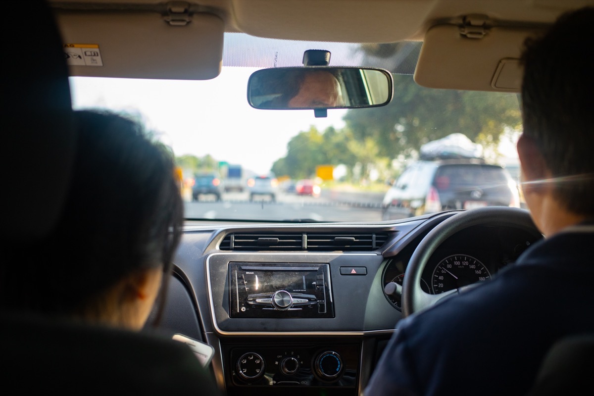 man driving a car