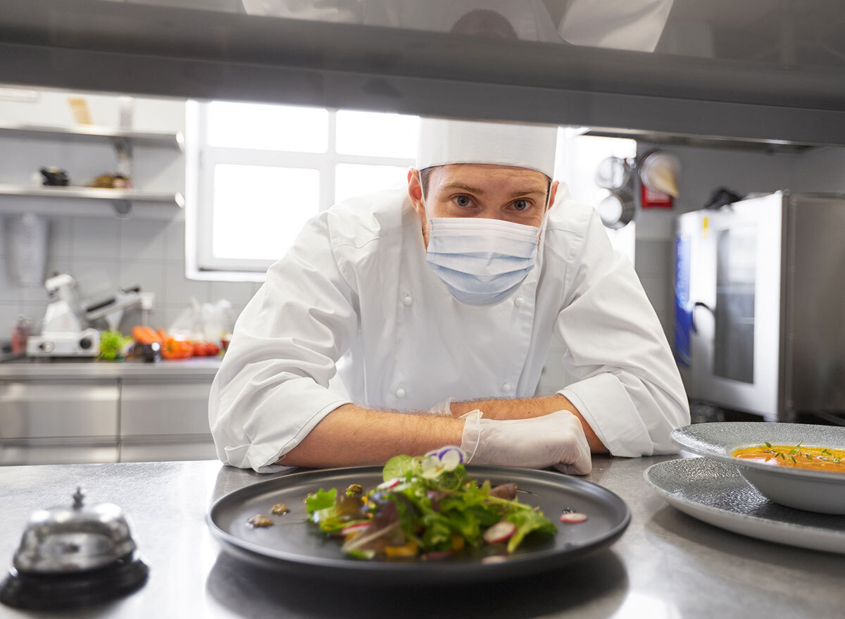 Chef cooking with a mask