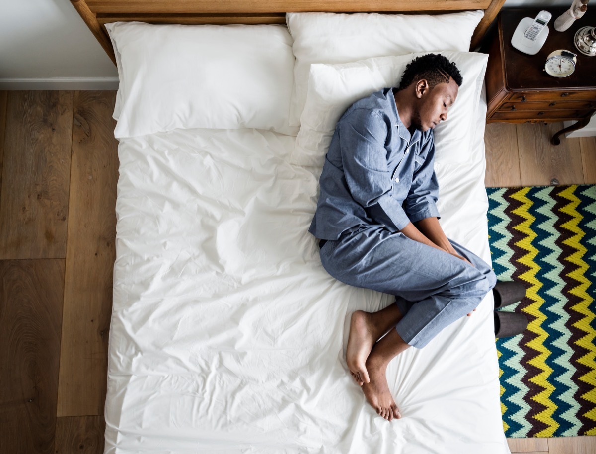 lonely man sleeping on the bed