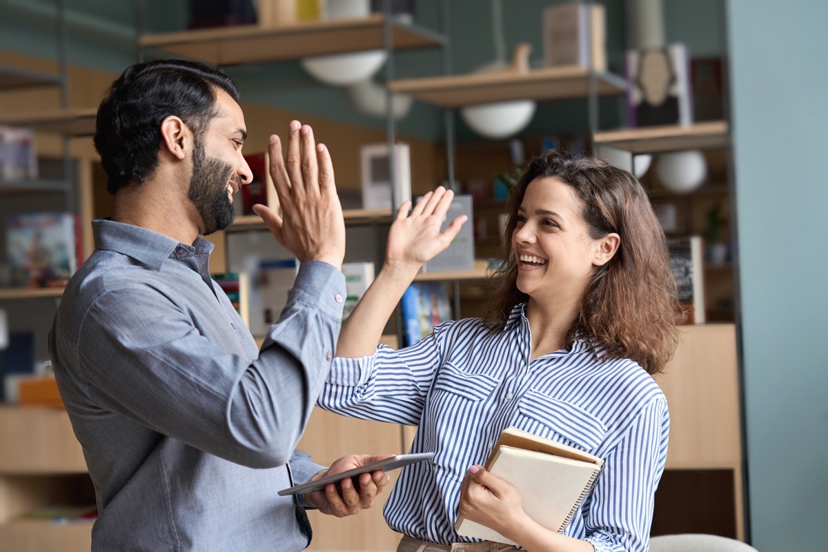 Supportive Colleagues High Fiving