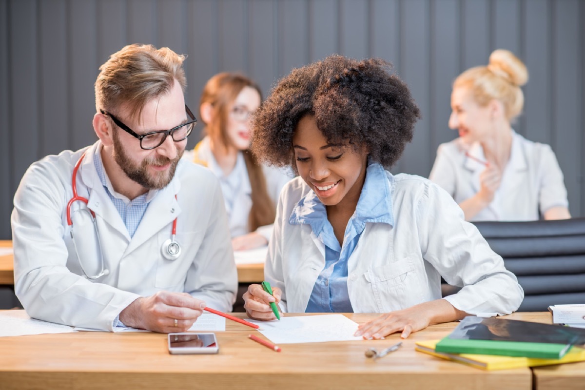 two nurses studying at table, school nurse secrets