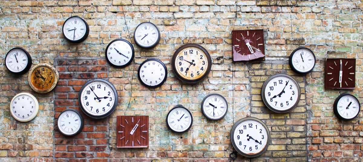 Wall of vintage clocks