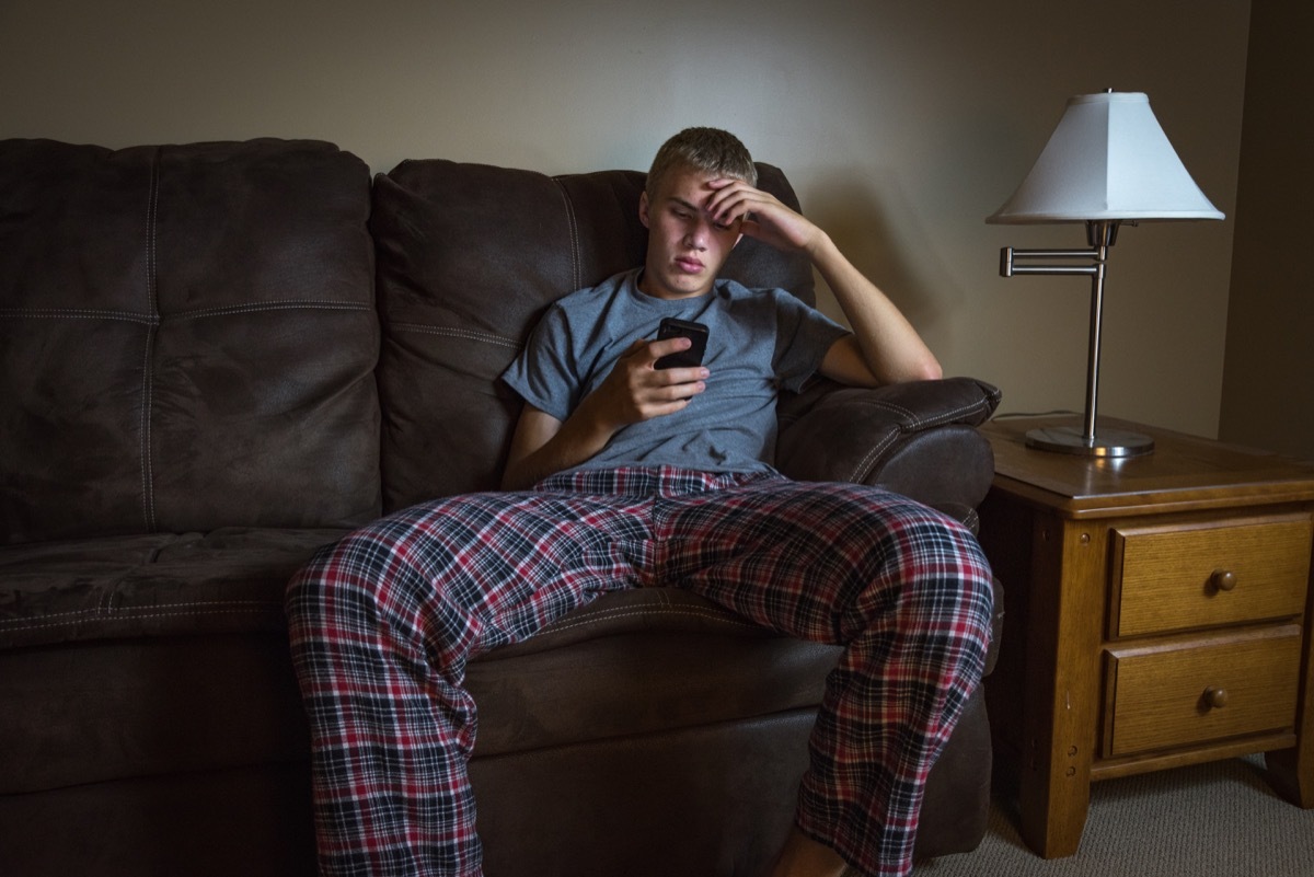 white teenage boy on couch