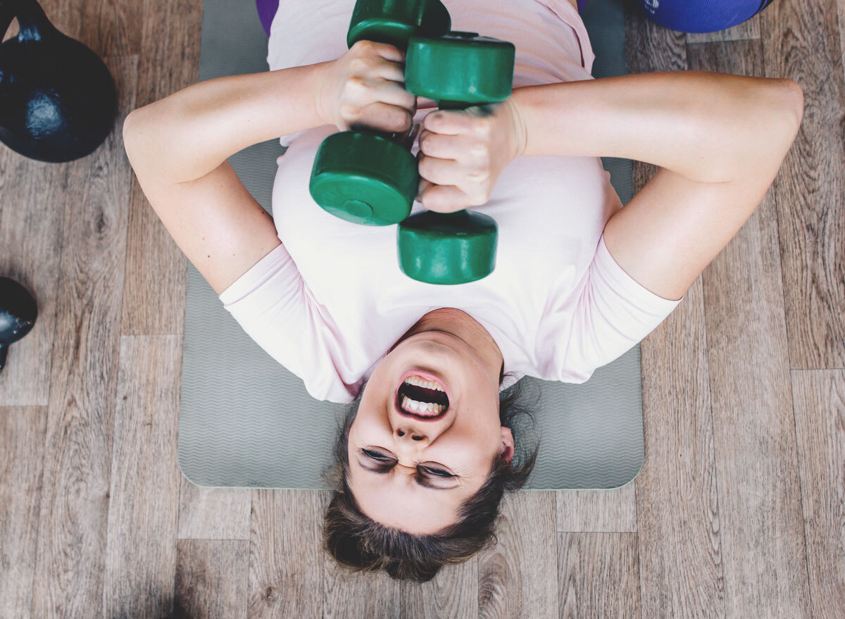 woman working out exercising too hard hurt herself