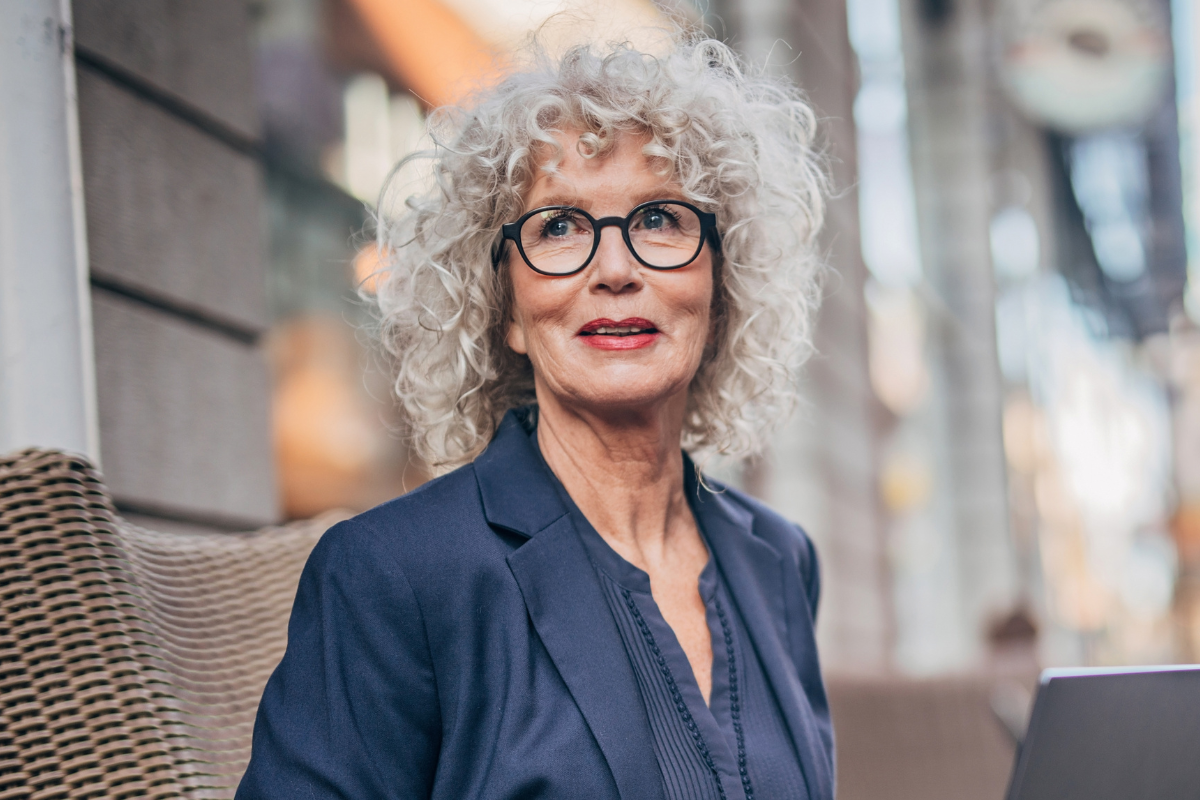 older woman with curly gray hair