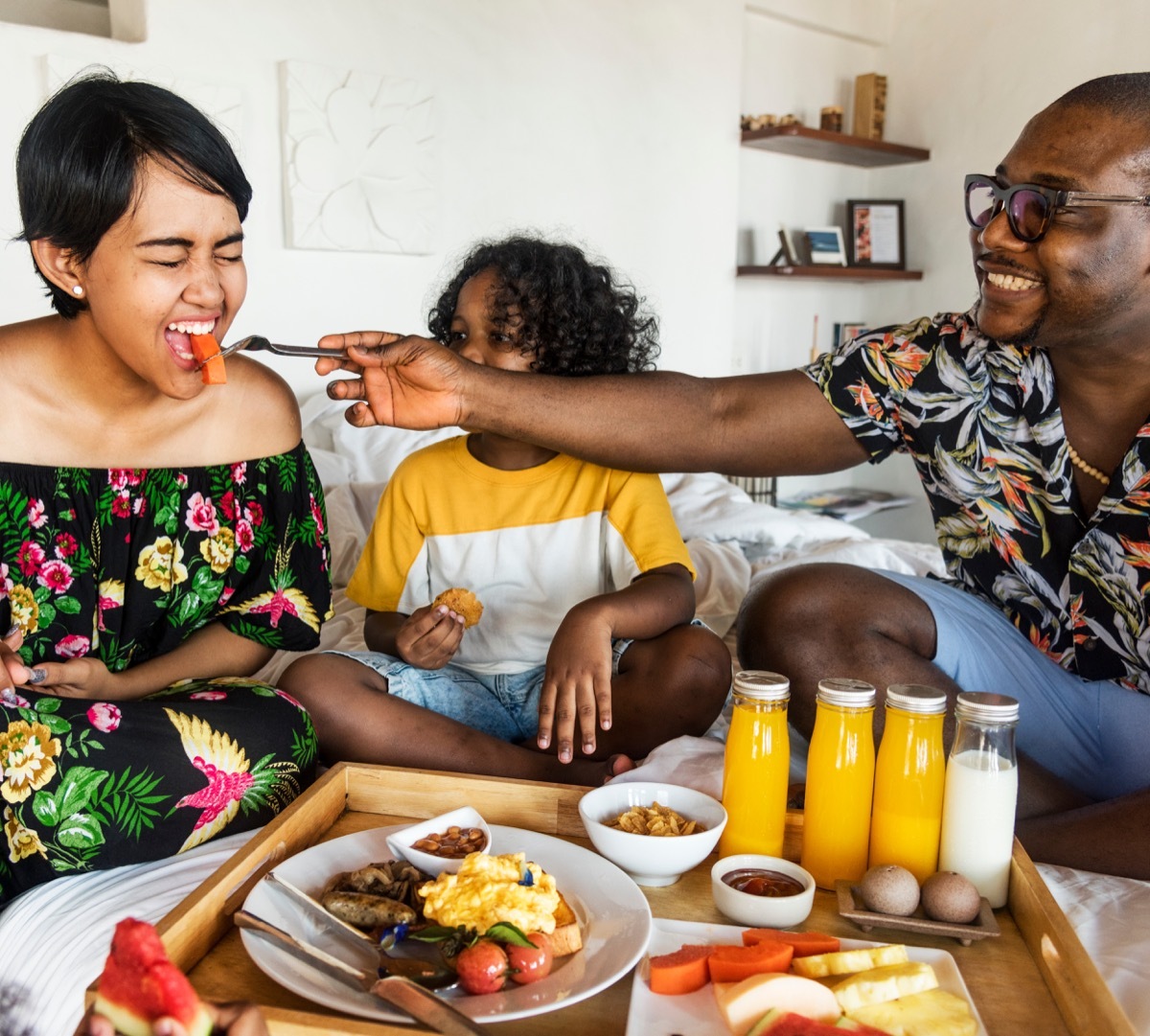 Family having brunch in bed