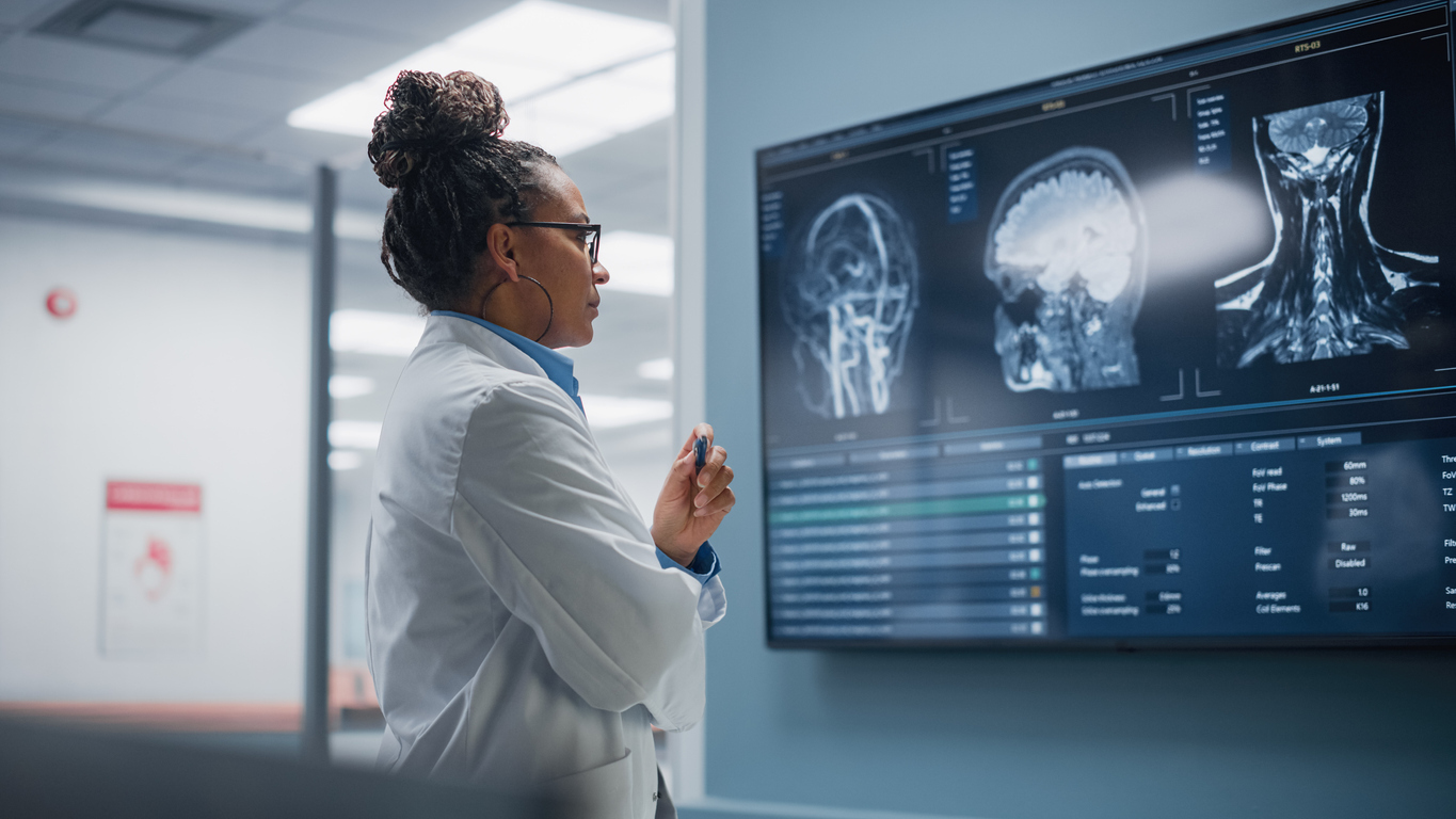 Neurologist looking at brain scan.