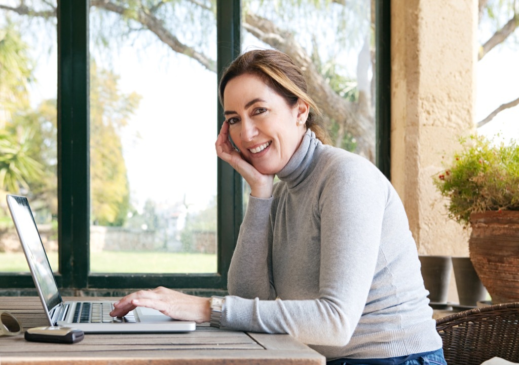 woman at work on laptop, working mom