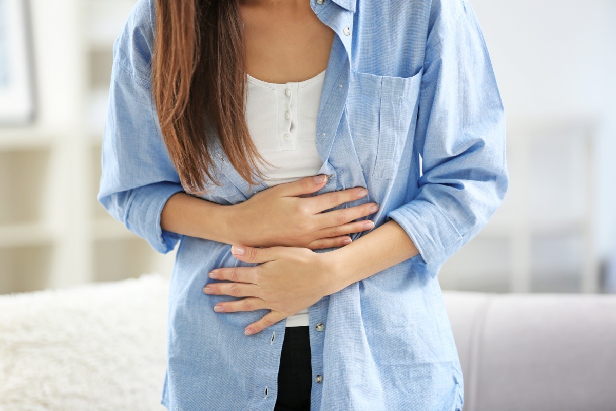 Woman Holding Her Stomach