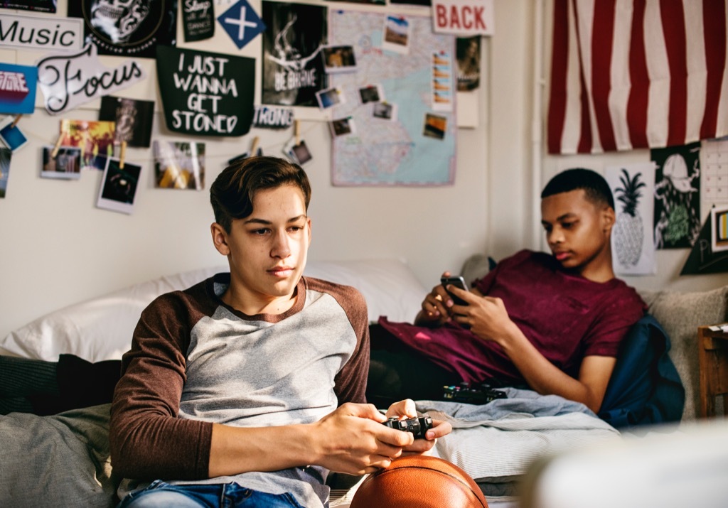 teenage boys playing video games