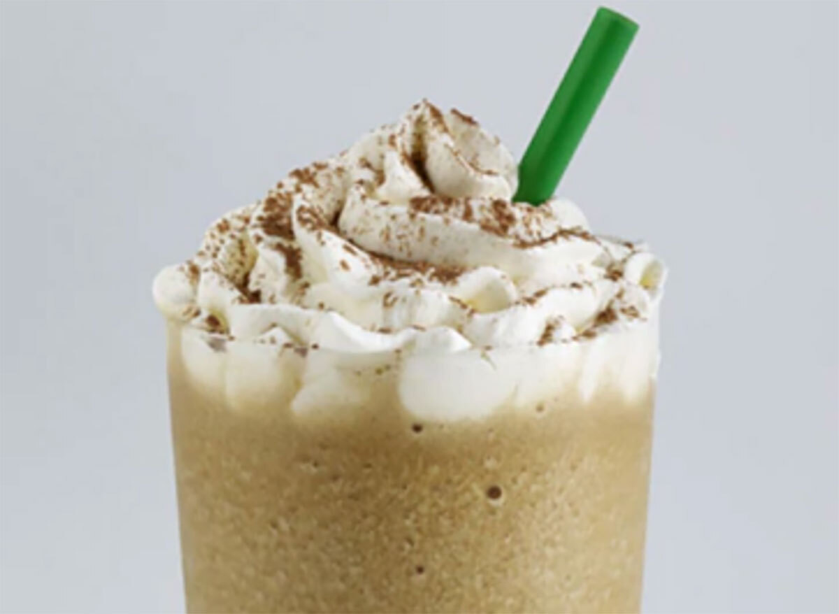 starbucks tiramisu frappuccino with green straw on gray background