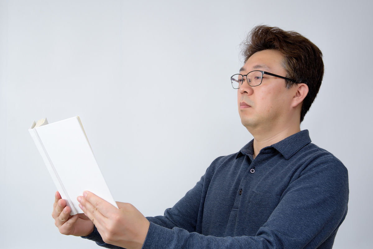 Man trying to read something