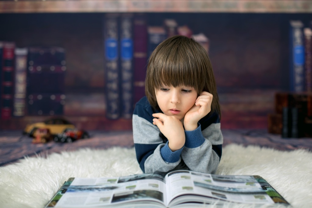 cute kid in home library