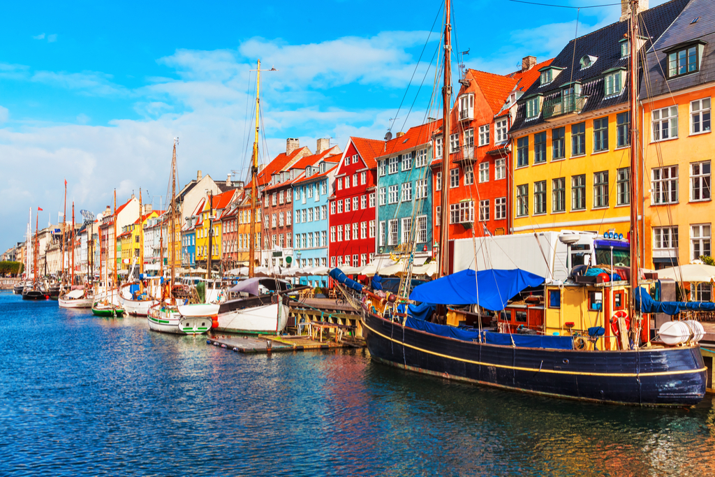 Scenic summer view of Nyhavn pier with color buildings, ships, yachts and other boats in the Old Town of Copenhagen, Denmark National Geographic bee questions