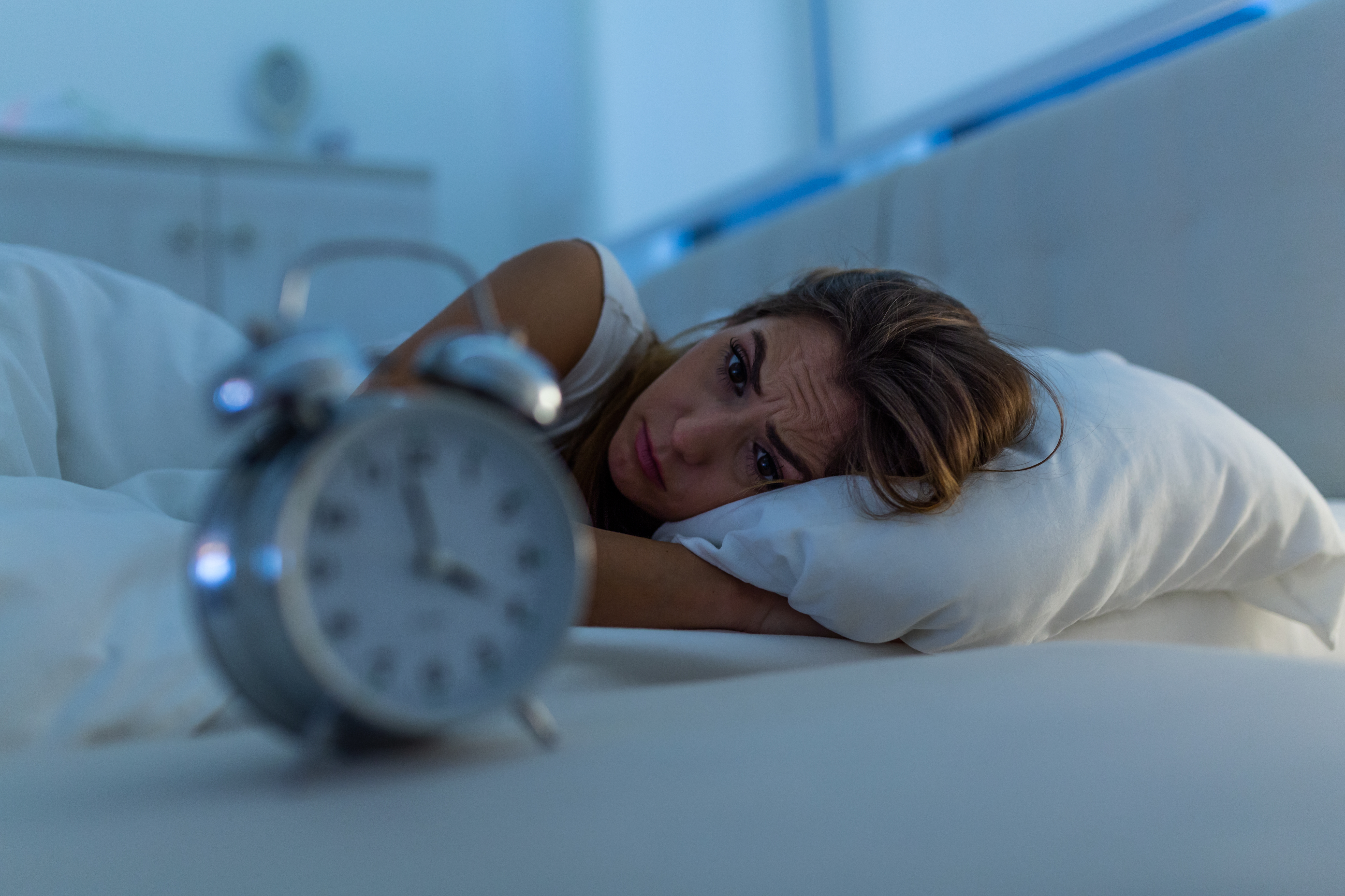 Woman with insomnia lying in bed