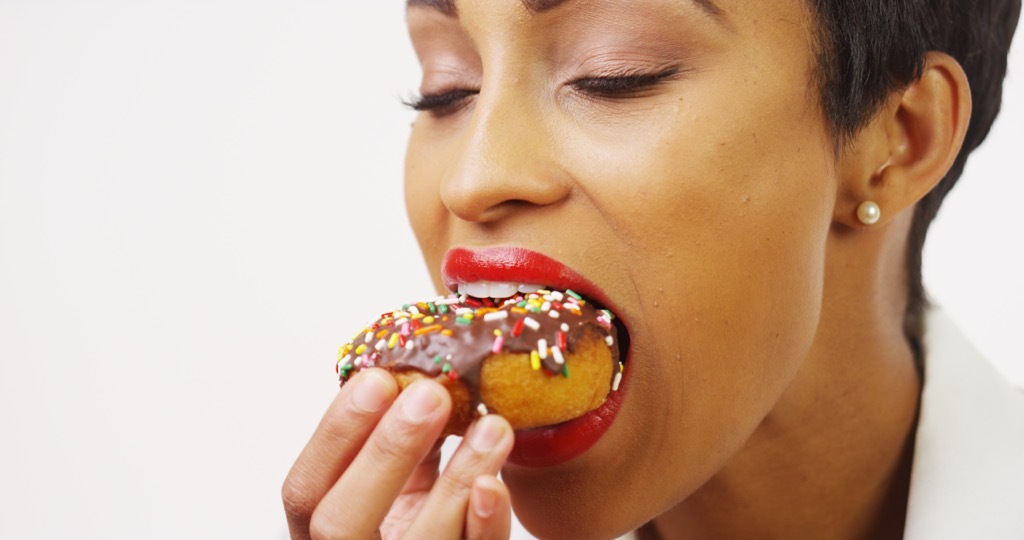 woman eating a donut