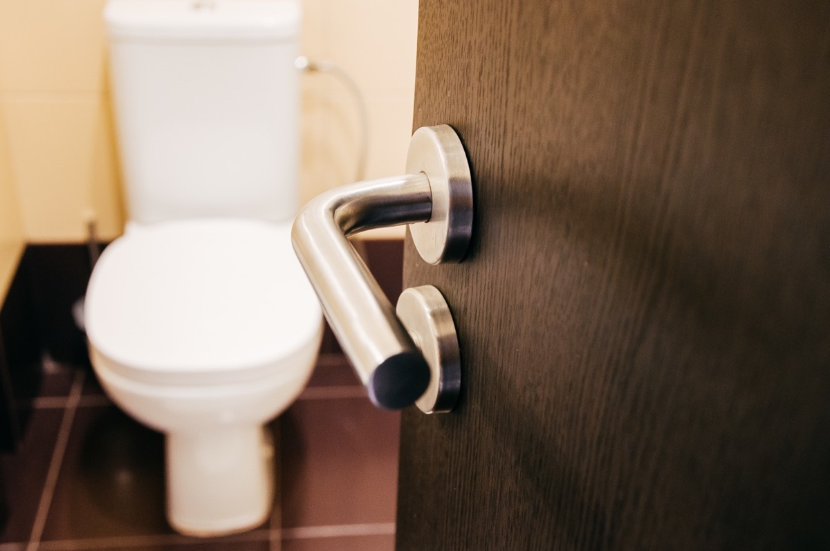 Bathroom door open looking at a toilet