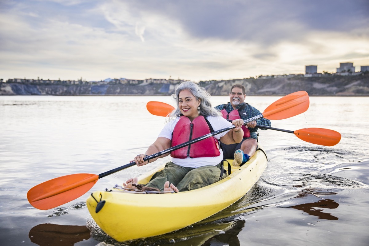 A beautiful senior Mexican couple kayaking