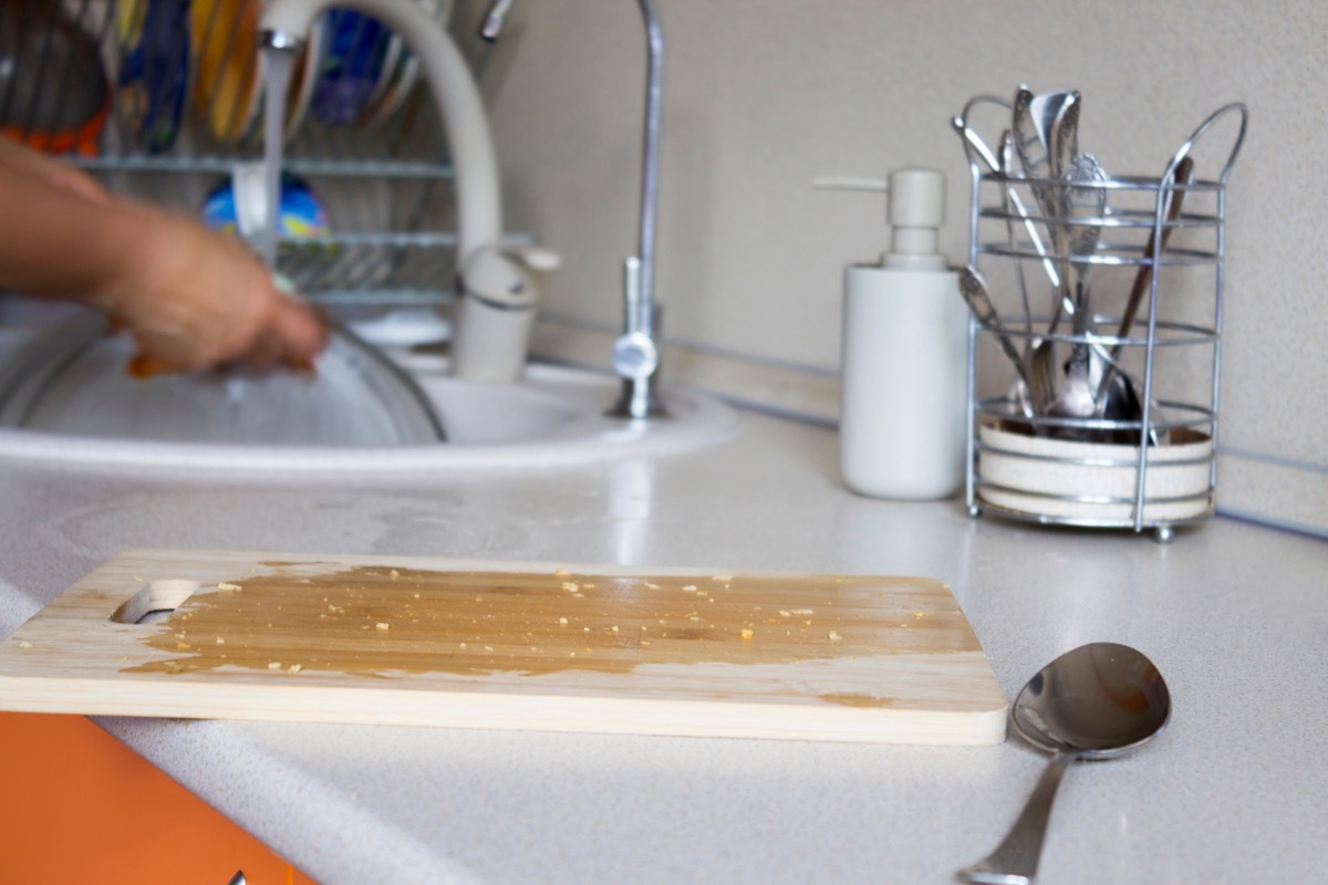 dirty wooden cutting board on kitchen counter