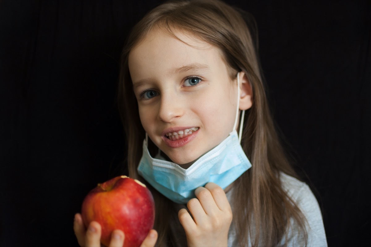 girl eating apple