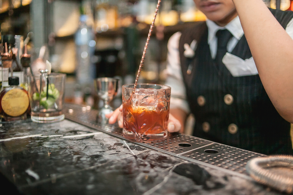 bartender making craft cocktail