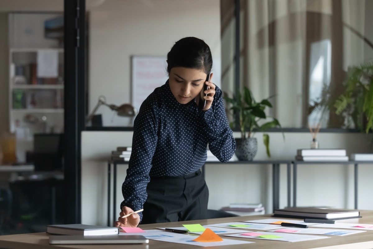 Person Organizing While on the Phone