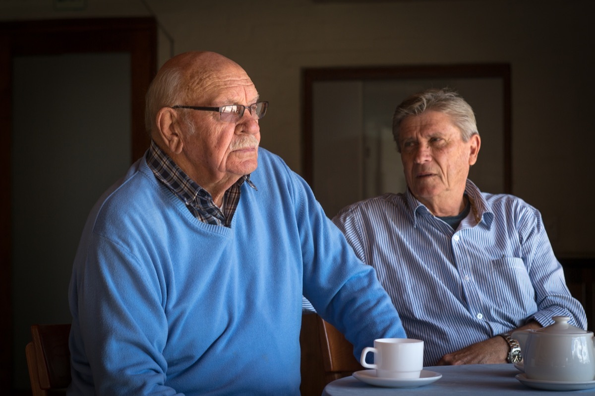 older boyfriends having a cup of coffee with an argument