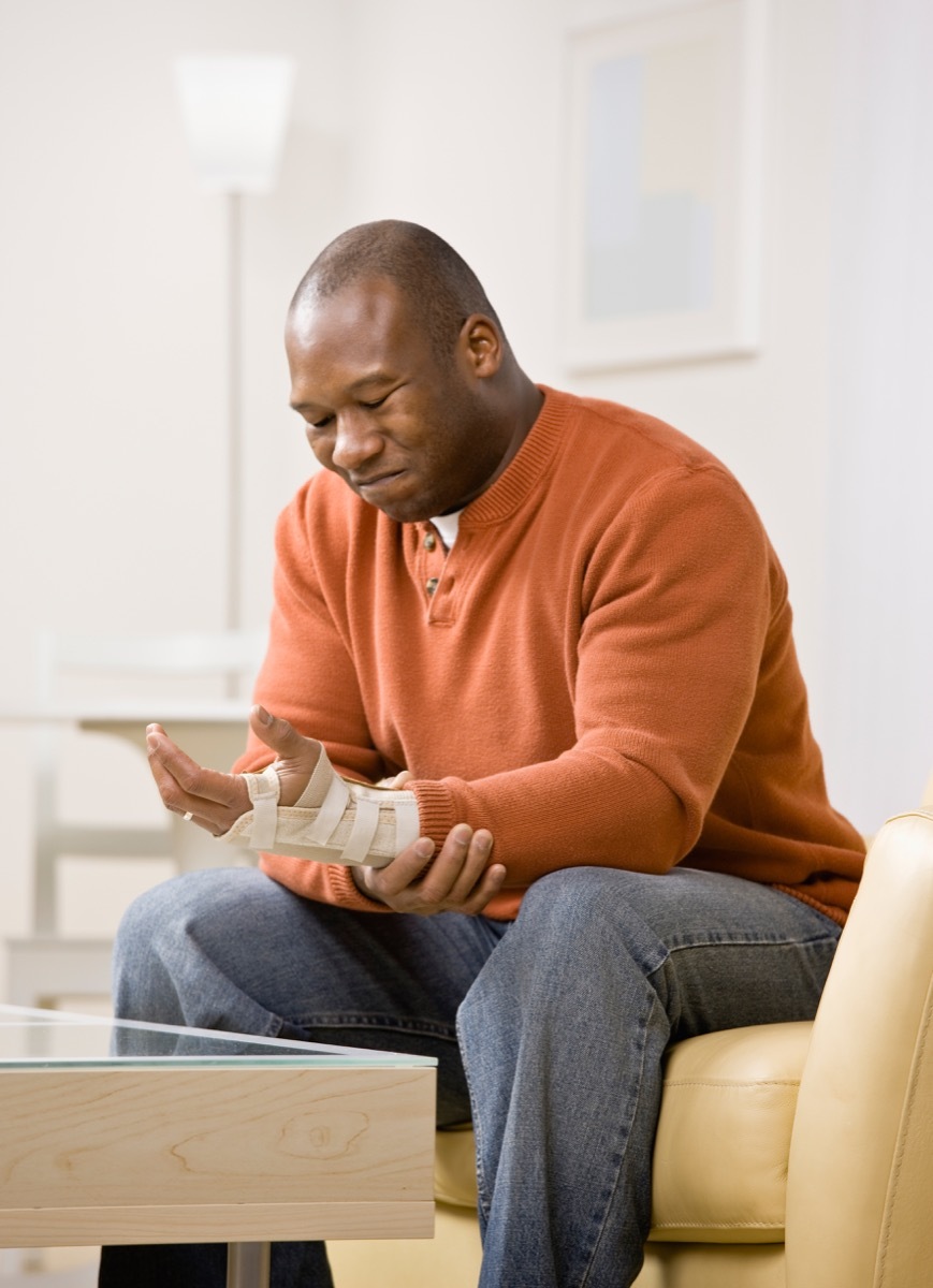 Man wearing a brace with wrist pain