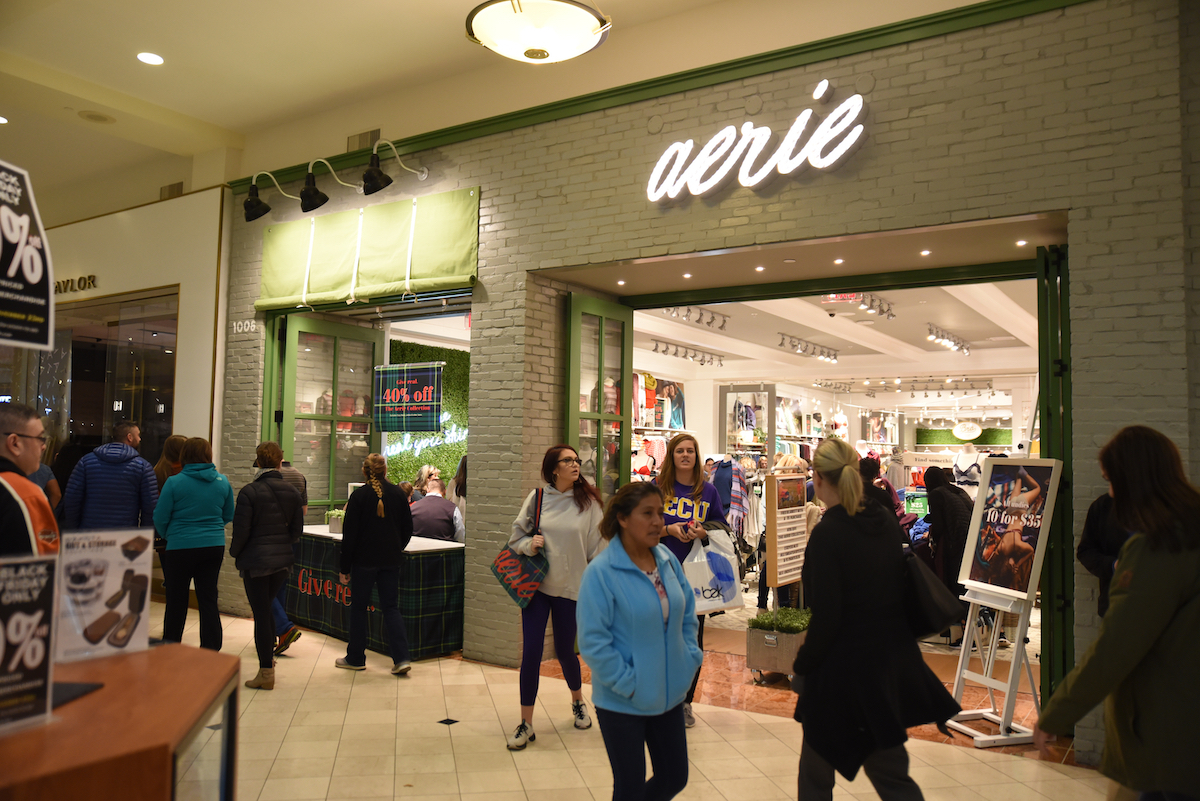 Mall shoppers hunt for discounted apparel at Aerie on Black Friday.