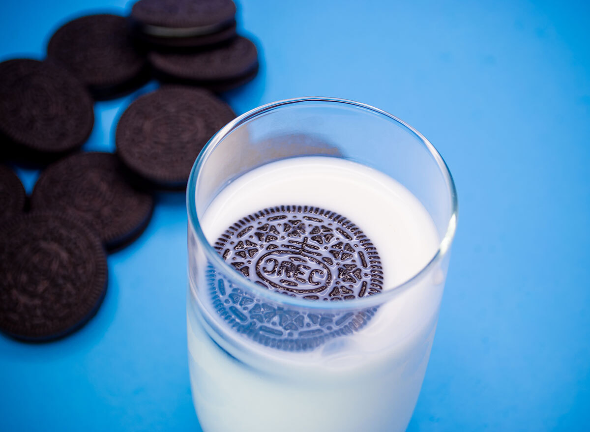 Oreo floating in a cup of milk