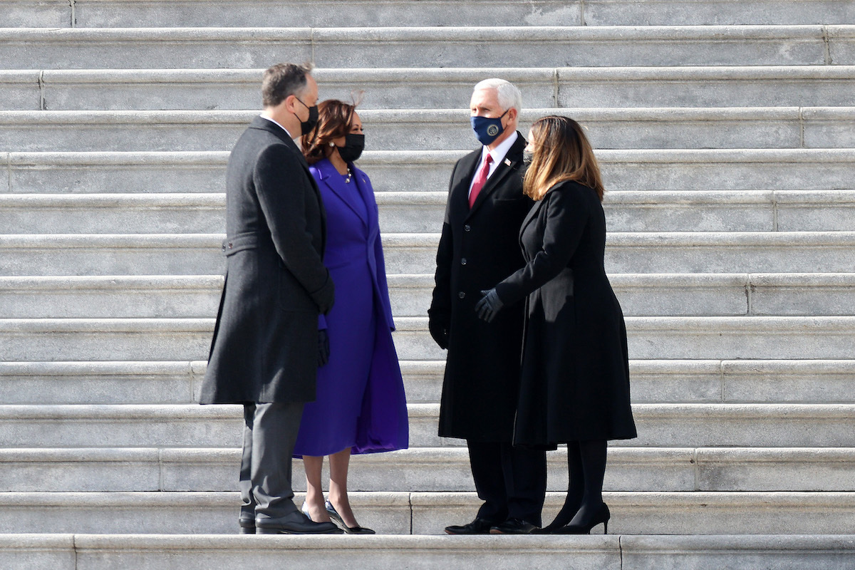 U.S. Vice President Kamala Harris and Second Gentleman Douglas Emhoff speak with former U.S. Vice President Mike Pence and former Second Lady Karen Pence on the steps of the East Front of the U.S. Capitol following the inauguration of U.S. President Joe Biden on January 20, 2021 in Washington, DC