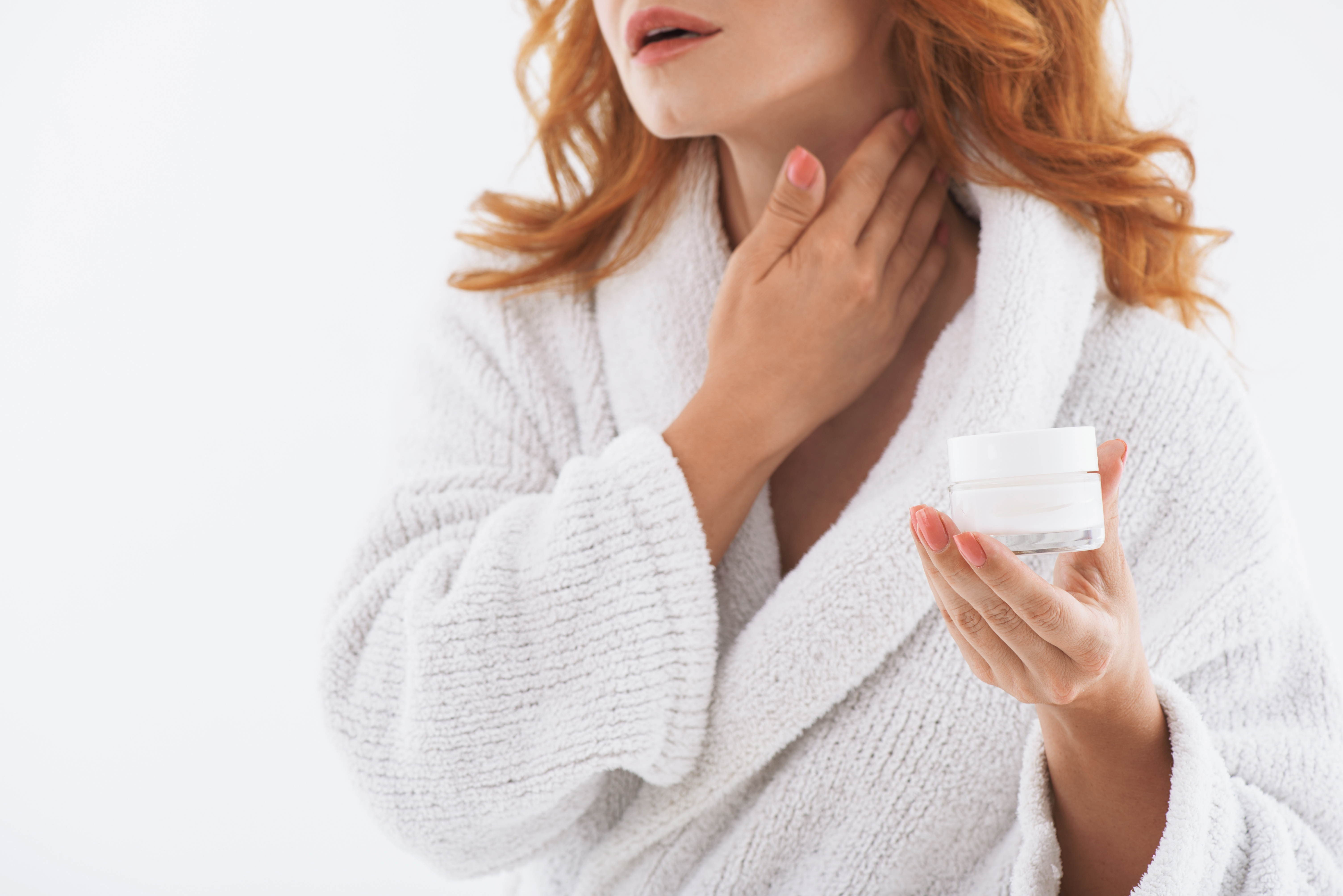 woman applying neck cream healthy skin after 40