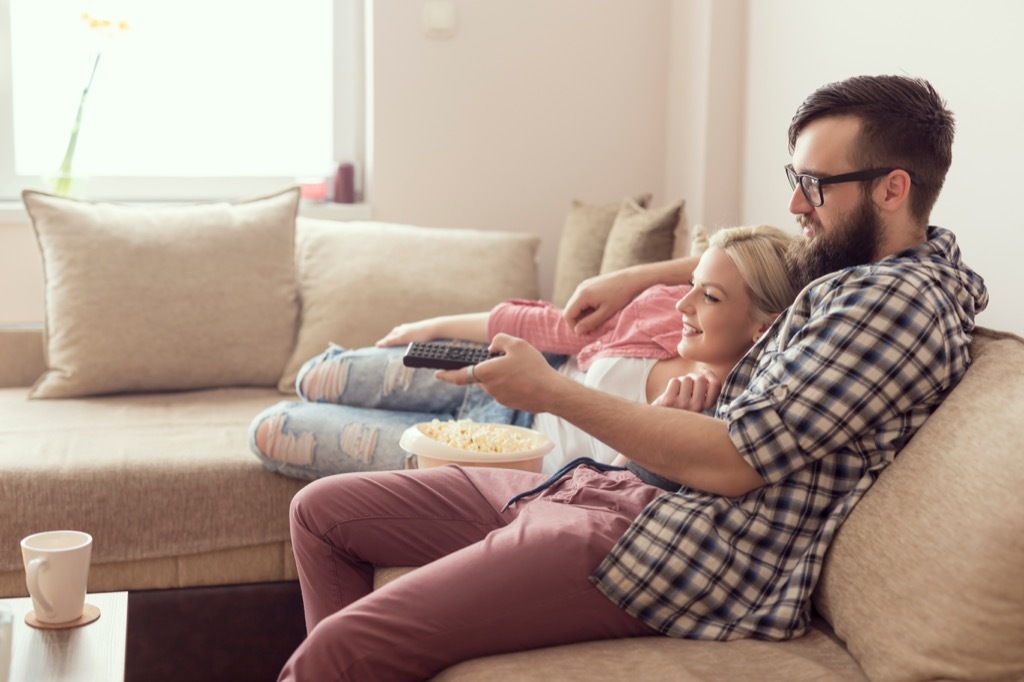 couple cuddling couch