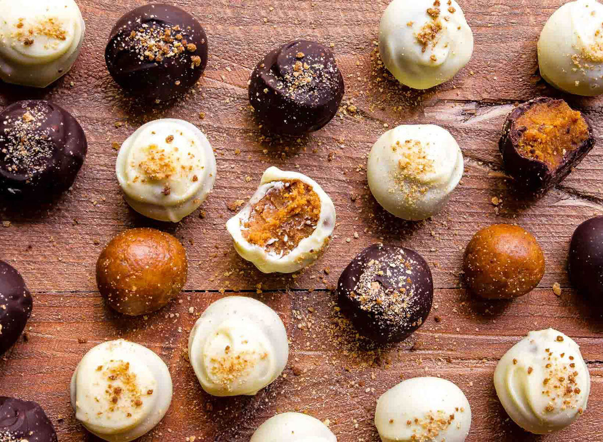 bite size chocolate pumpkin truffles made with white milk and dark chocolate