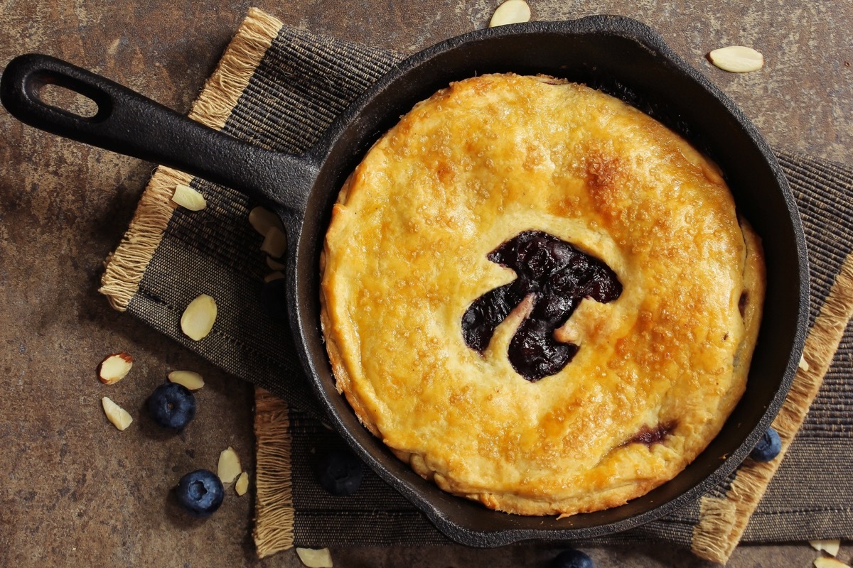 Pi Day special homemade blueberry pie baked in a skillet overhead view