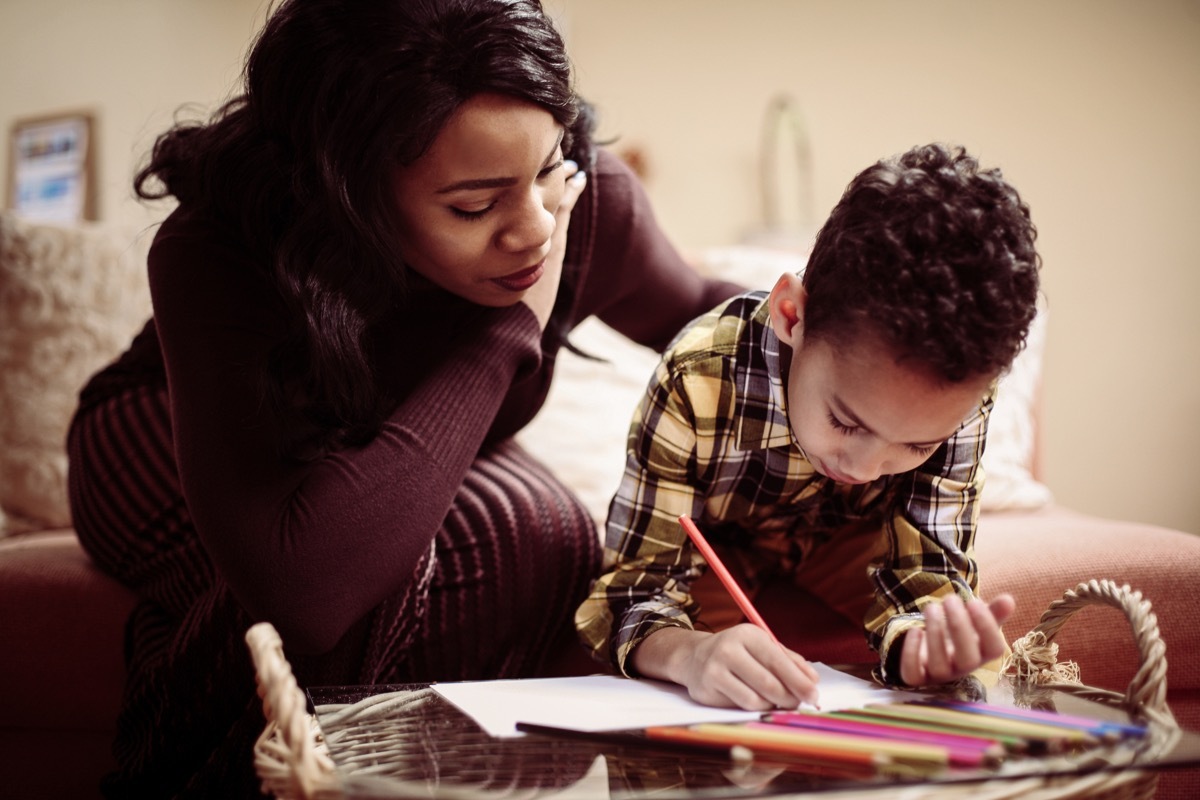 Mom doing homework with son