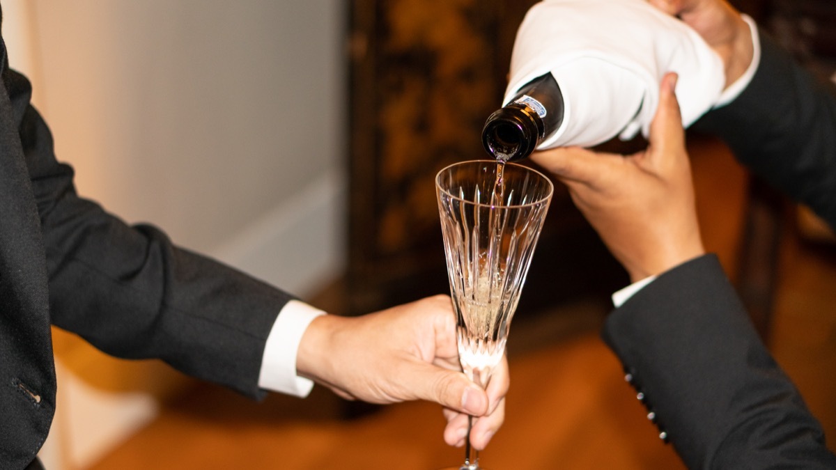 a groom drinking at his wedding