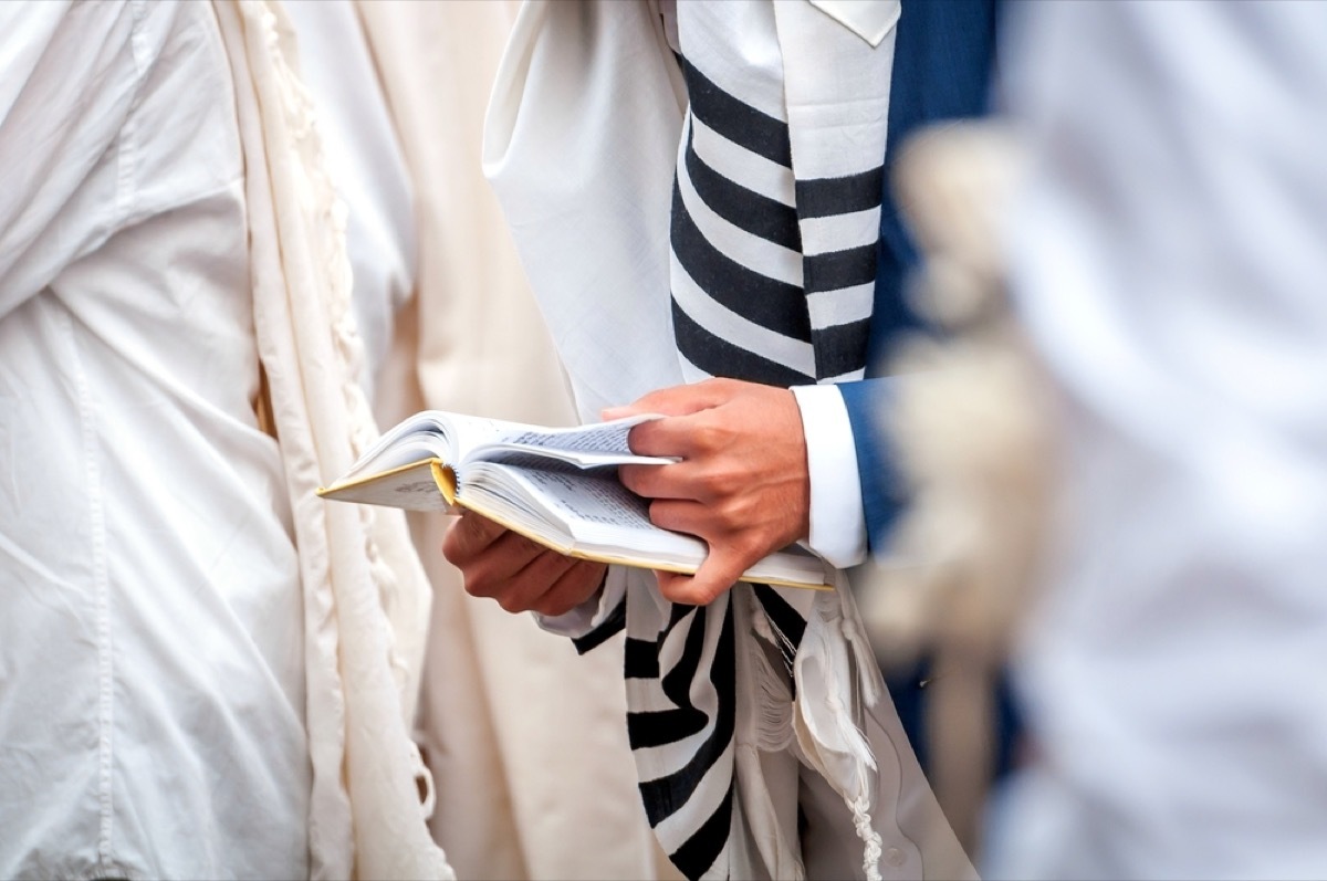 man wearing tallit and reading torah, rosh hashanah facts