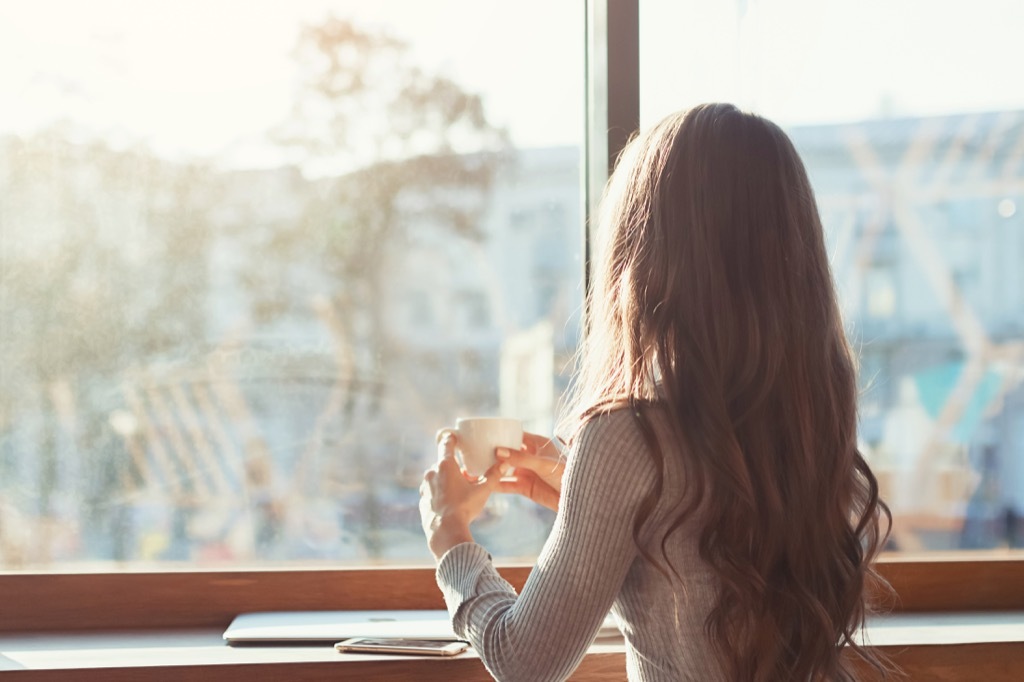 woman standing at cafe