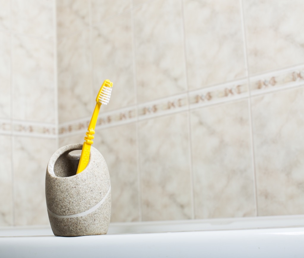 Toothbrush holder in the bathroom things to throw away 