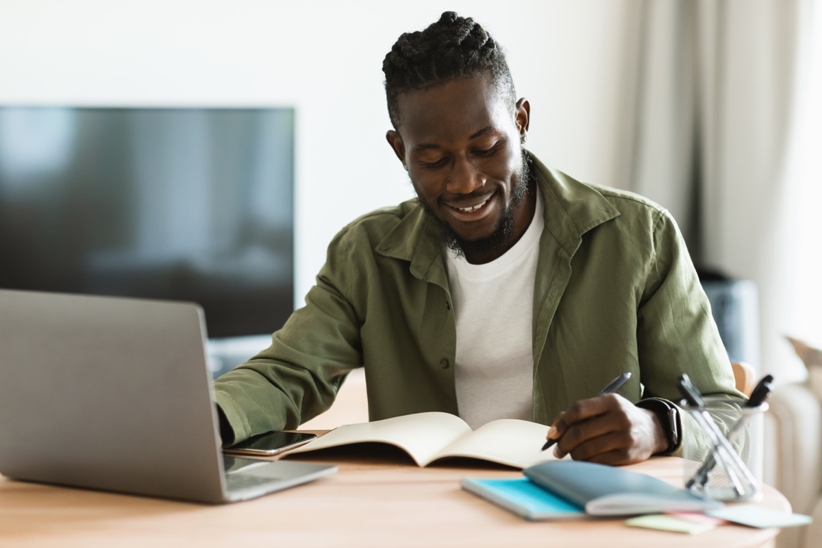 man sitting at his desk for an online class