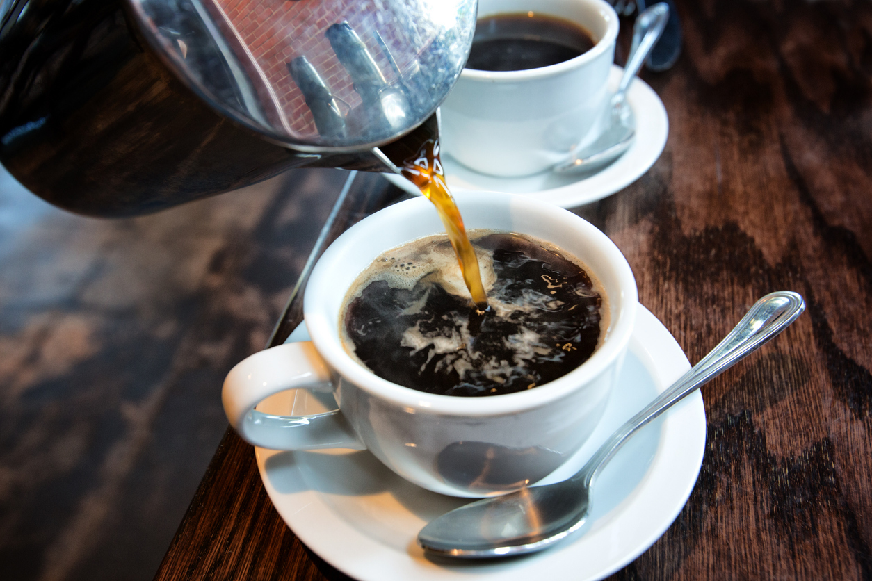 Coffee being poured into a cup.