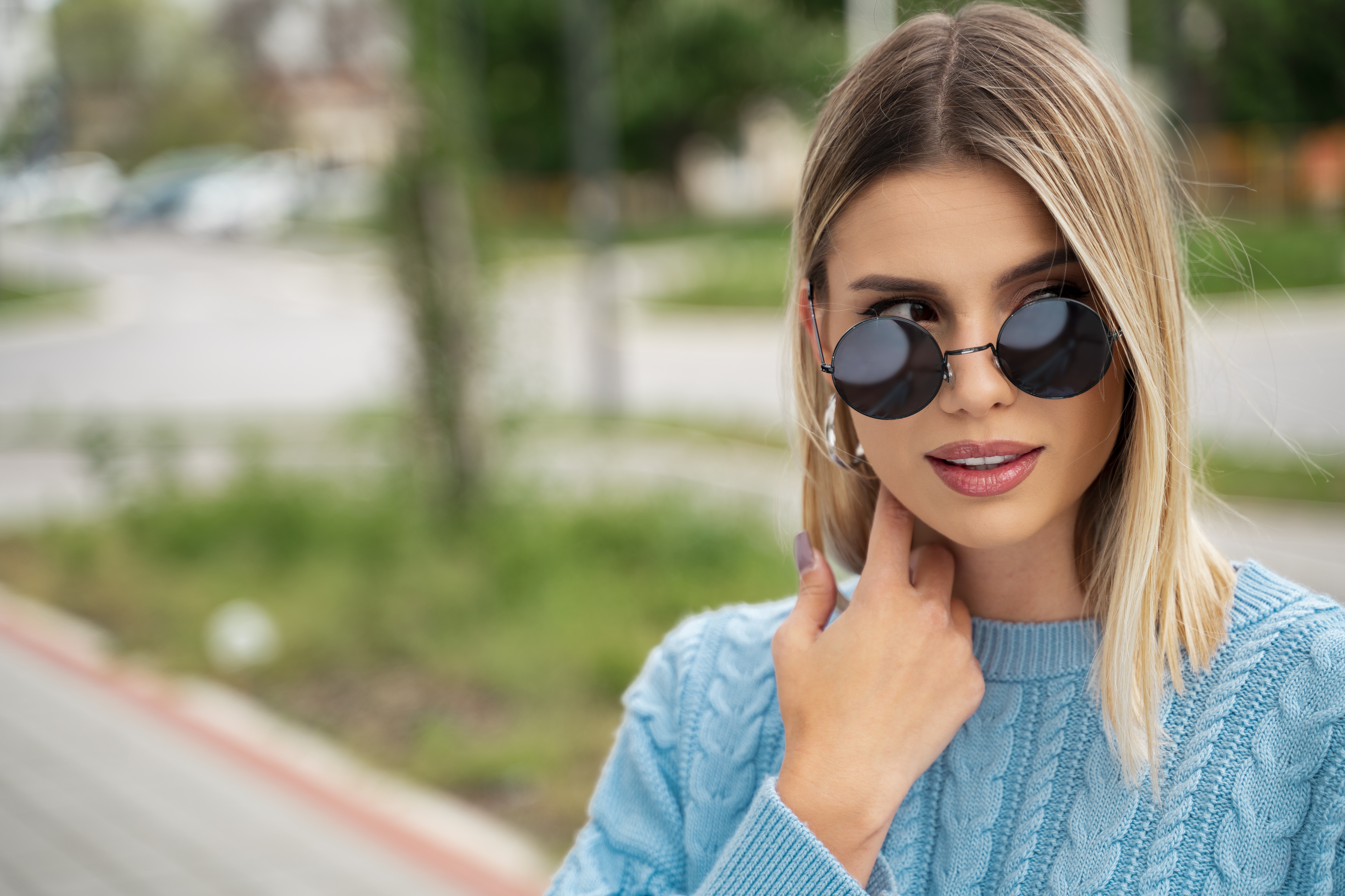 Portrait of amazing blonde girl with sunglasses, closeup shot