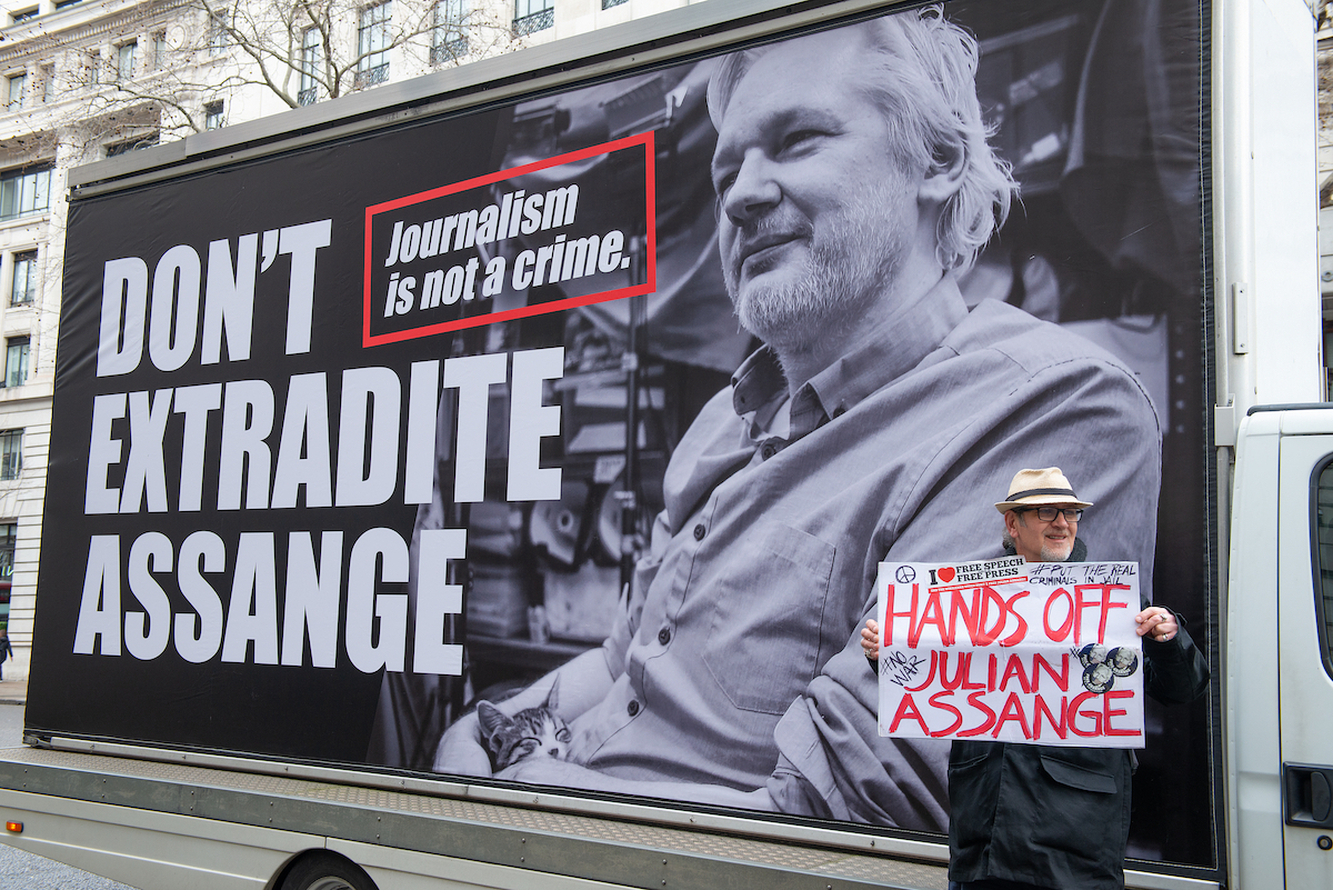 A protester standing in front of a 