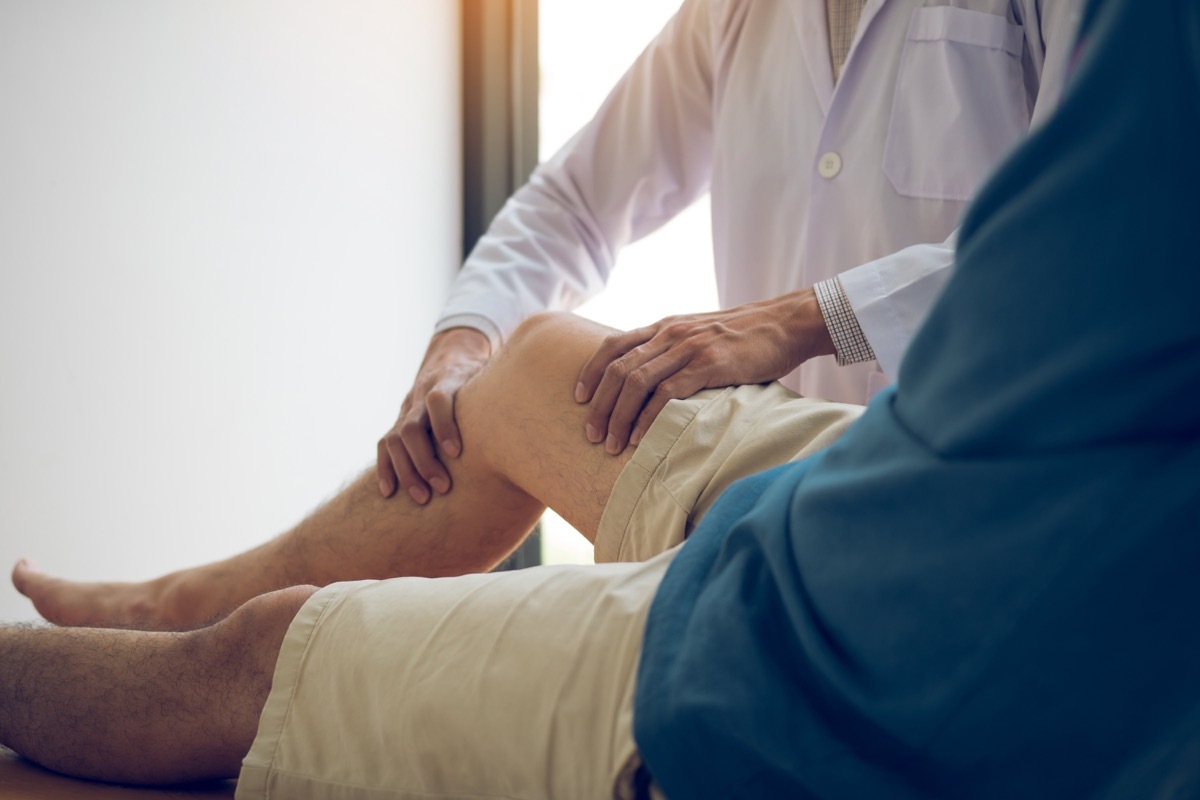 Doctor checking on patient's weak knee muscle