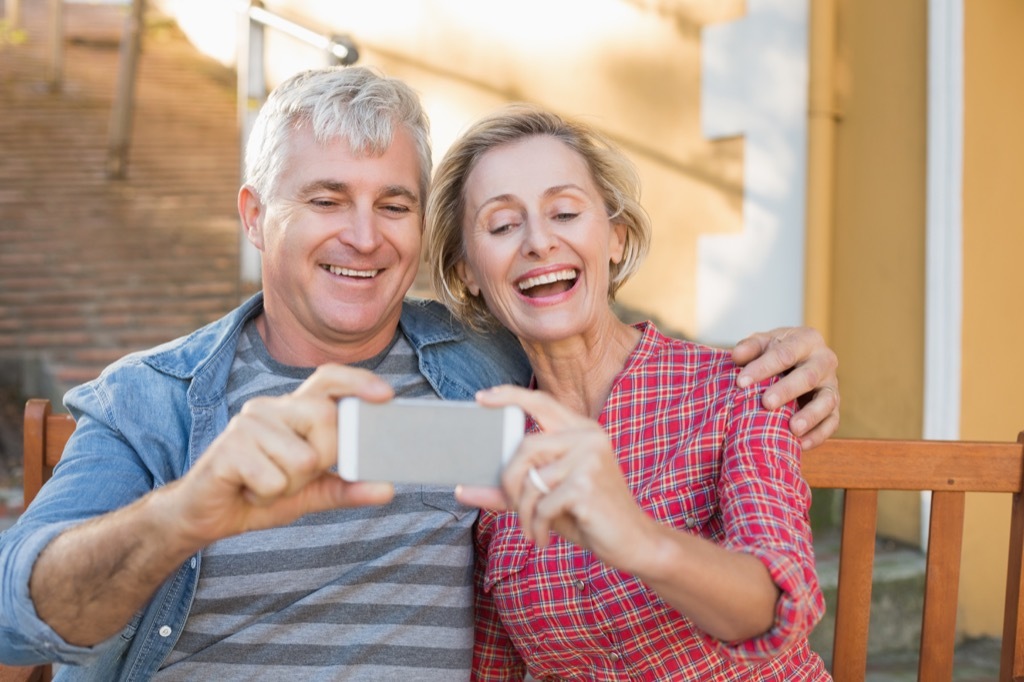 older couple taking photo, better wife after 40