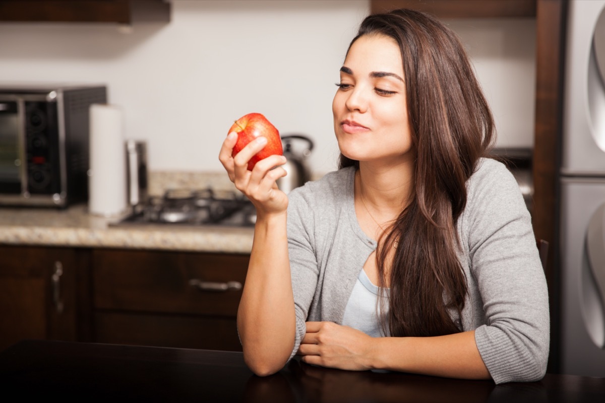 Woman eating an apple