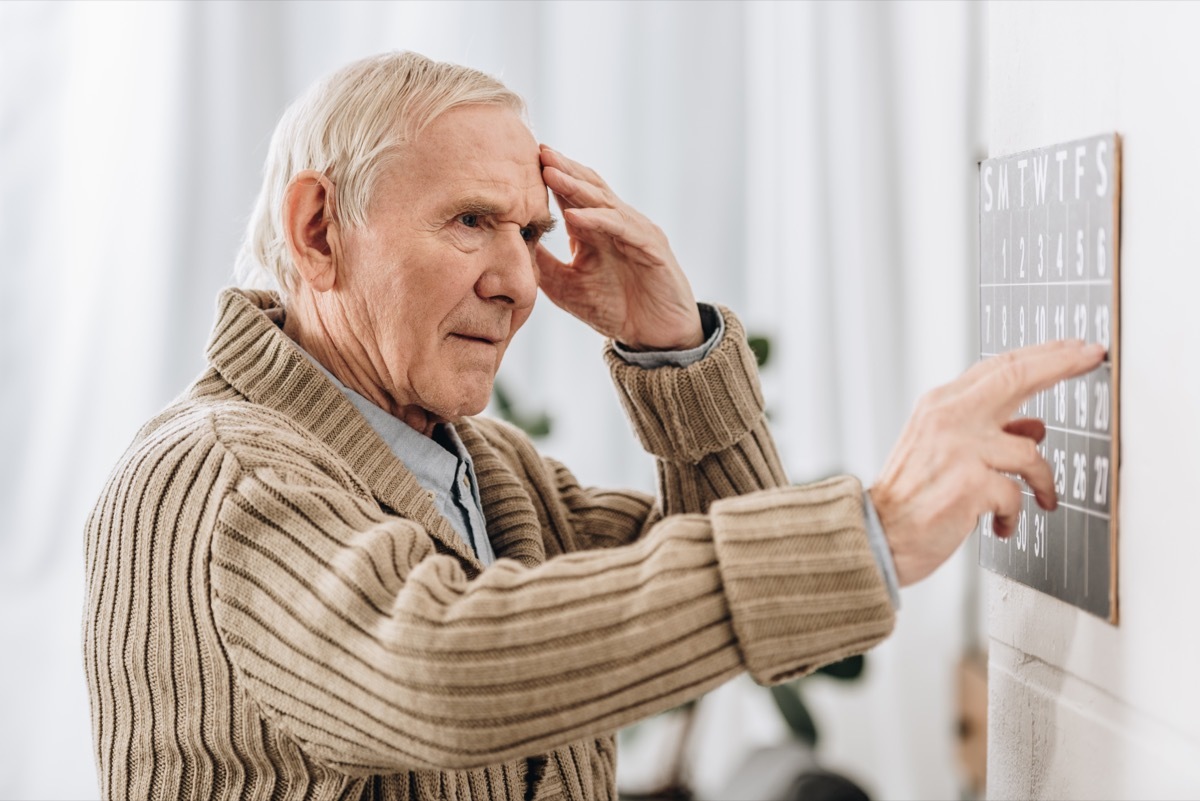 Senior Man Looking at Calendar