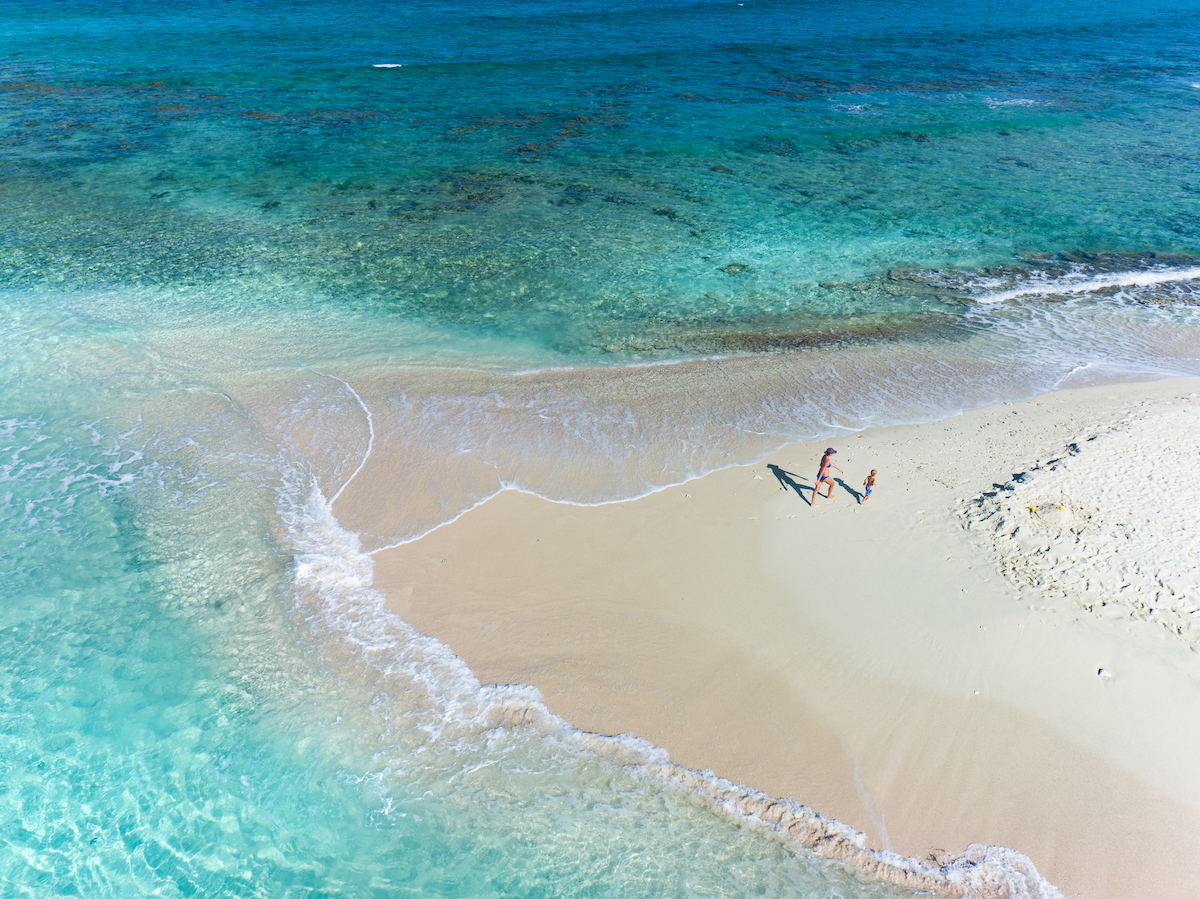 Aerial view of mother and child on a sandbar in the British Virgin Islands