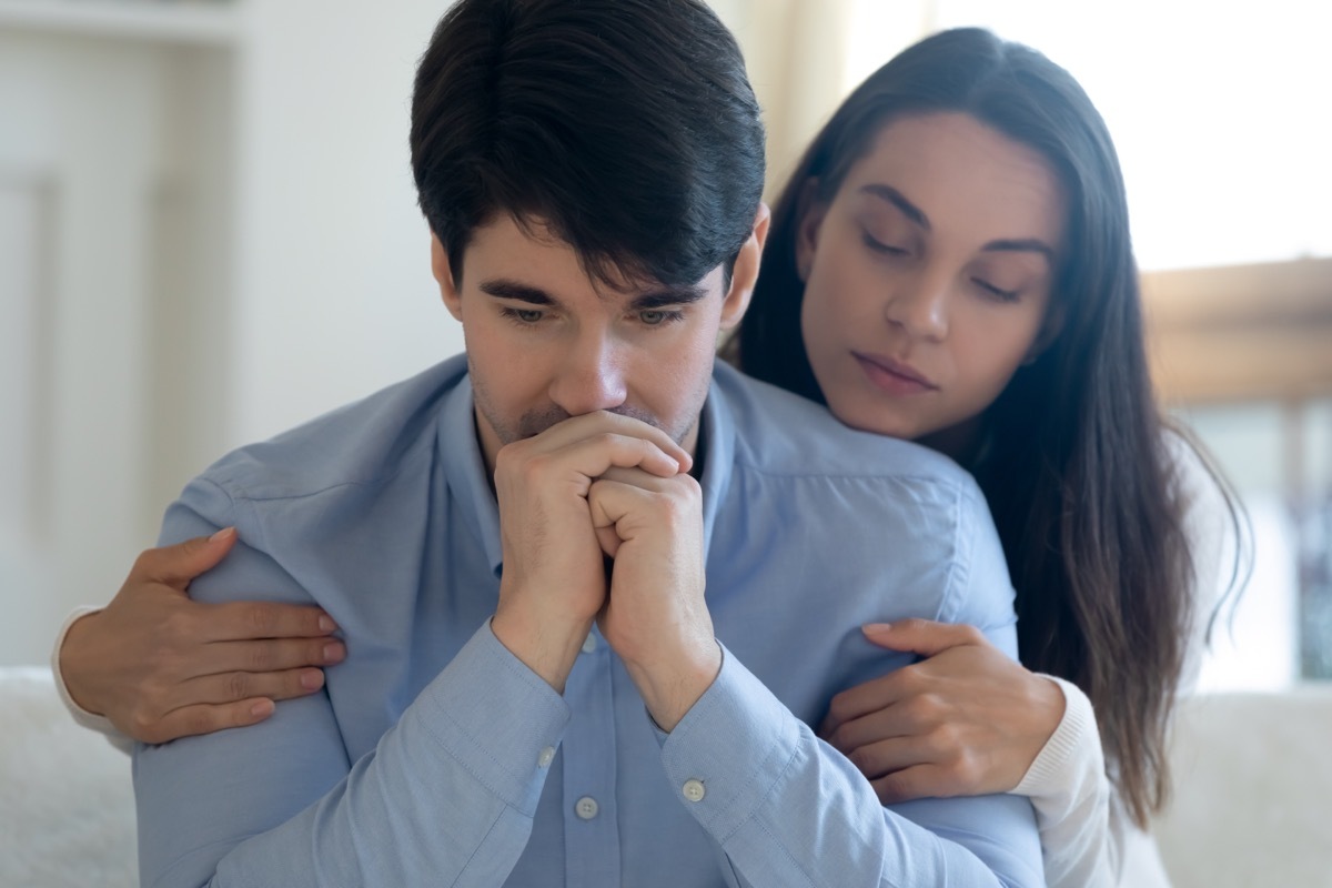 Woman Holding Man in Forgiveness